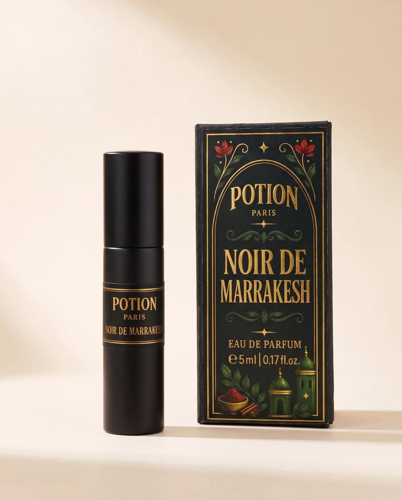 The Noir de Marrakesh fragrance tube beside its green and gold book-box, every word of the packaging legible.